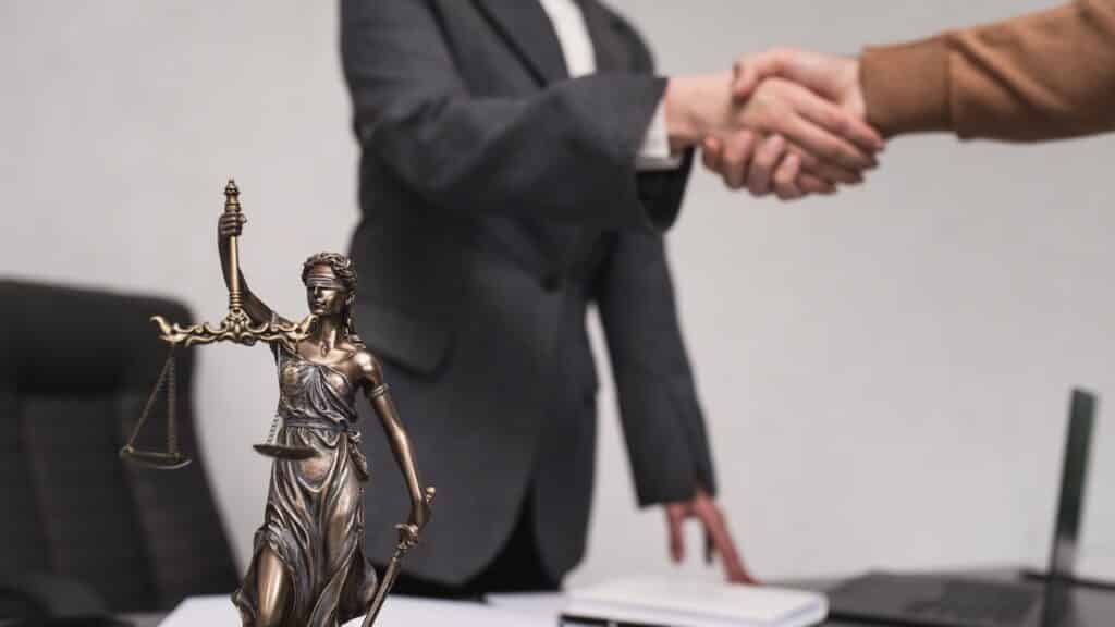 Client shakes hands with lawyer