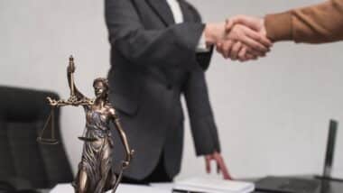 Client shakes hands with lawyer