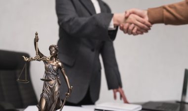 Client shakes hands with lawyer