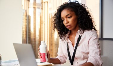 business woman drinking protein shake for breakfast