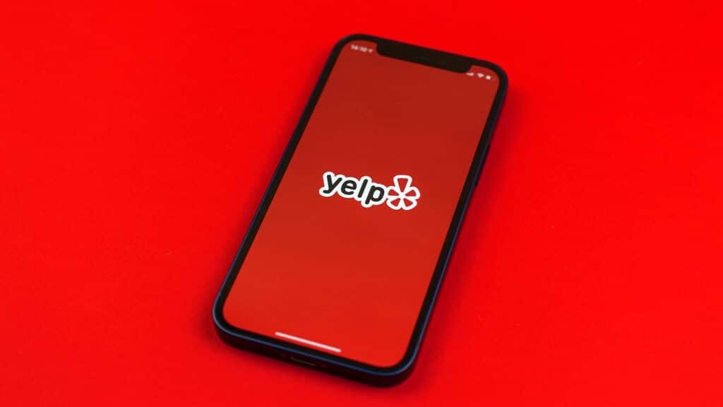 Yelp logo on smartphone screen