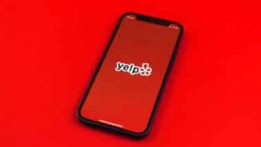 Yelp logo on smartphone screen