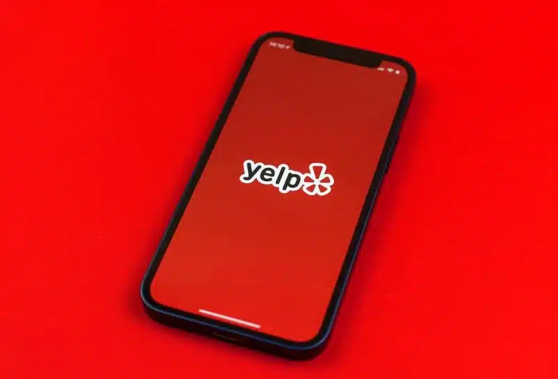 Yelp logo on smartphone screen