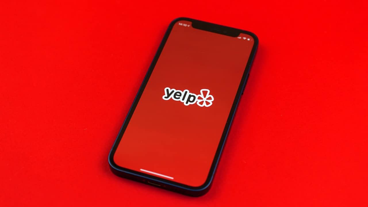 Yelp logo on smartphone screen