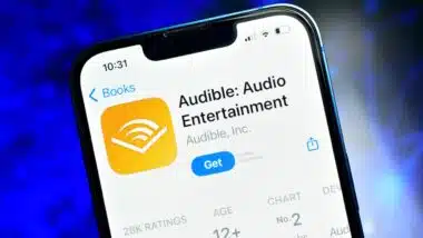 Audible app on smartphone used to listen audio content like podcast stories