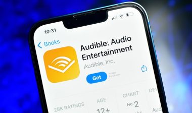 Audible app on smartphone used to listen audio content like podcast stories