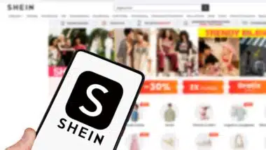 Shein logo online marketplace ecommerce on a mobile phone and computer in Stuttgart, Germany.