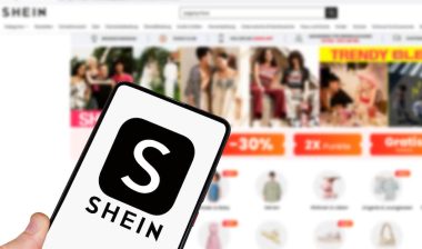 Shein logo online marketplace ecommerce on a mobile phone and computer in Stuttgart, Germany.