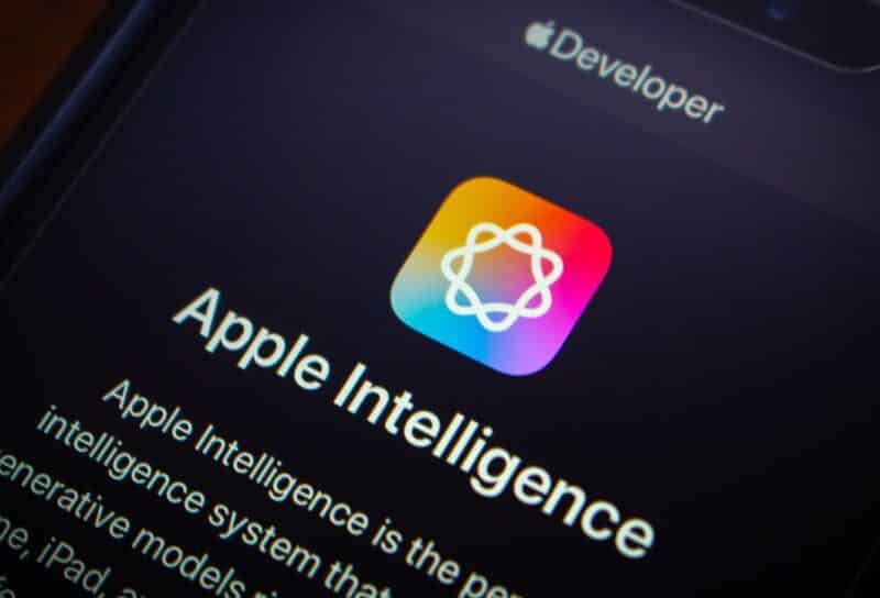 Apple Intelligence website is displayed in an iPhone. Apple Intelligence is AI system features designed to enhance UX across its devices (iPhone, iPad, and Mac)