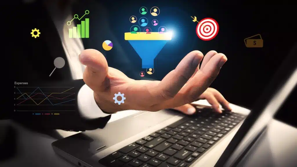 Generating Business leads and customers concept with colorful shapes floating over the hand and laptop in the backdrop.