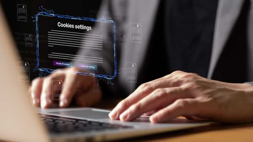 hand using laptop while choose to accept internet cookies policy