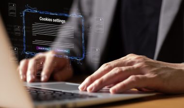 hand using laptop while choose to accept internet cookies policy