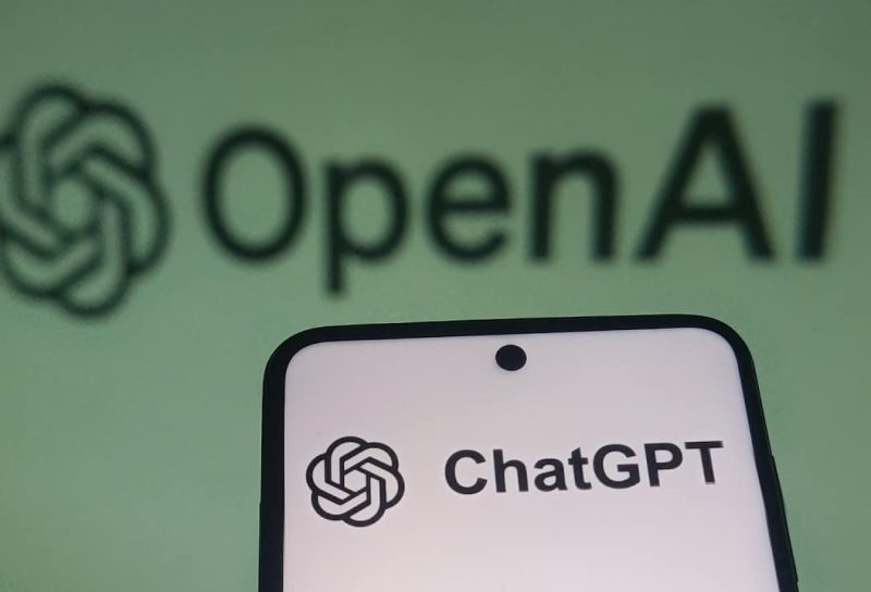 OpenAI ChatGPT logo on a smartphone screen with a blurred background.