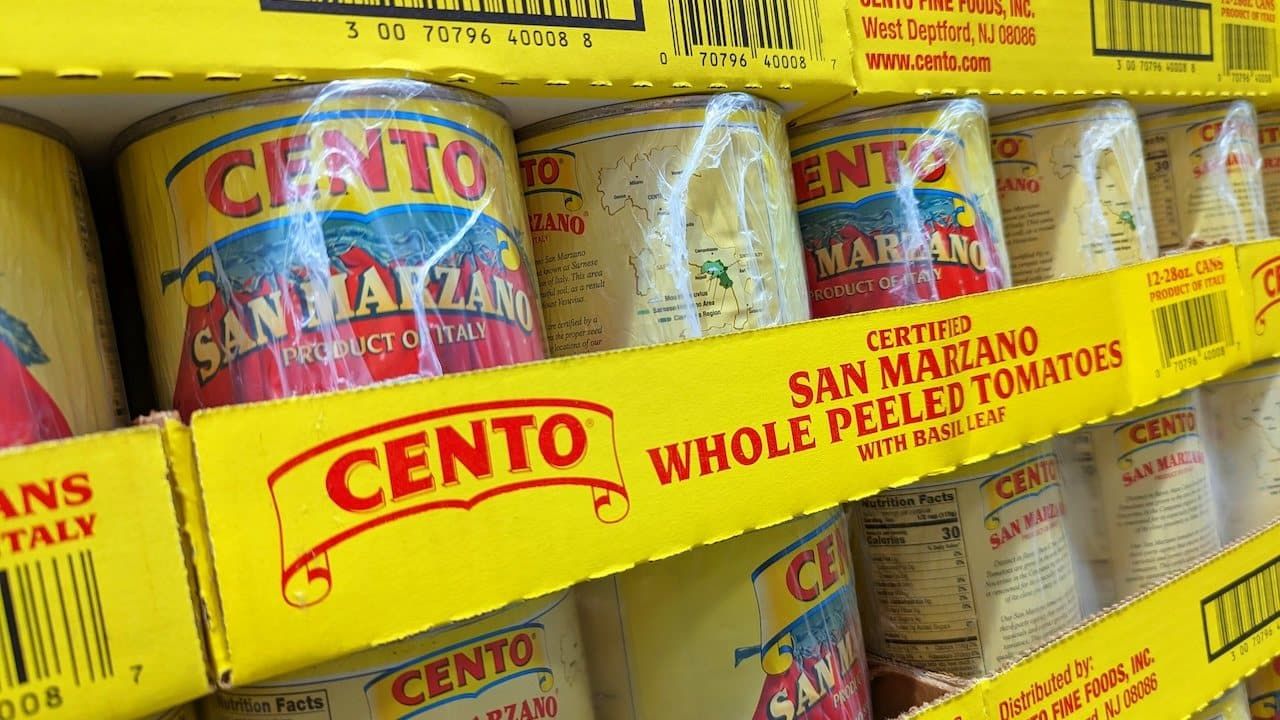 Cans of Cento San Marzano Whole Peeled Tomatoes on Shelf at Costco