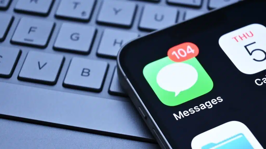 iPhone messages app appears on phone screen.