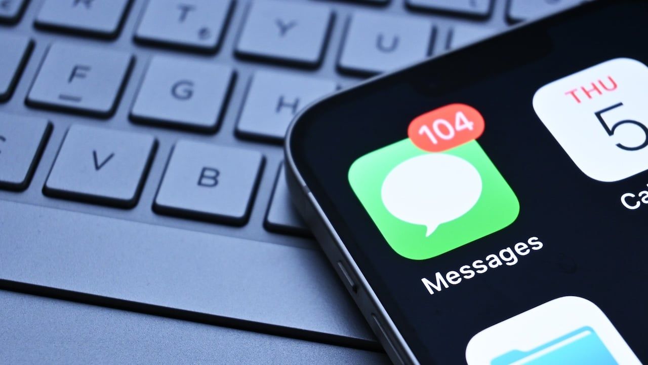 iPhone messages app appears on phone screen.