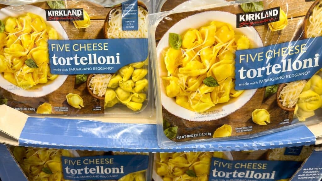 Kirkland Signature Five Cheese Tortelloni containers stacked on display in Costco Wholesale warehouse store