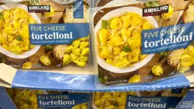 Kirkland Signature Five Cheese Tortelloni containers stacked on display in Costco Wholesale warehouse store