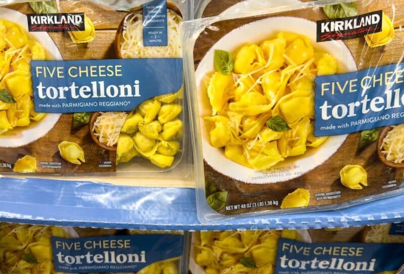 Kirkland Signature Five Cheese Tortelloni containers stacked on display in Costco Wholesale warehouse store