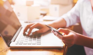 women hands holding credit card for online payment