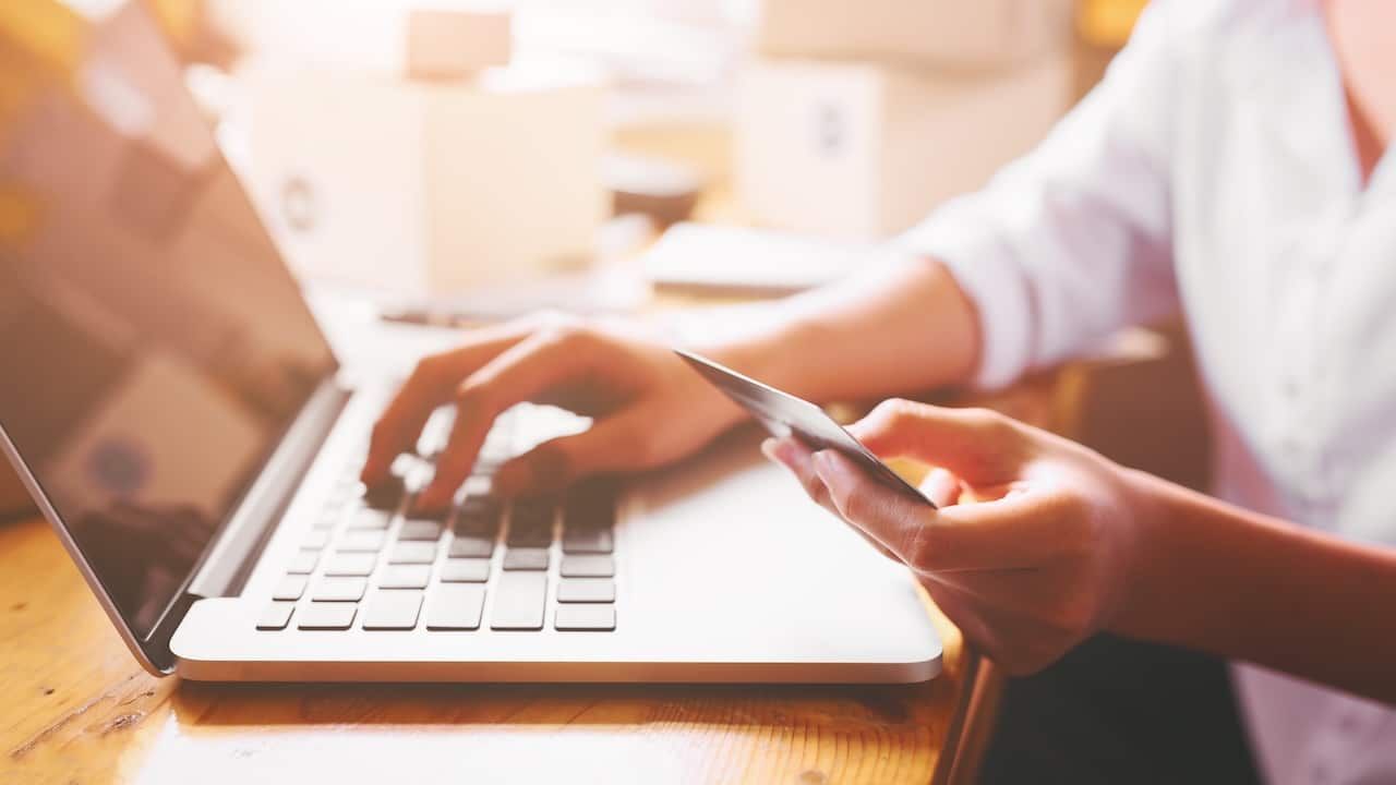 women hands holding credit card for online payment