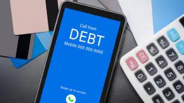 Top view of incoming call on smart phone screen from Creditor.