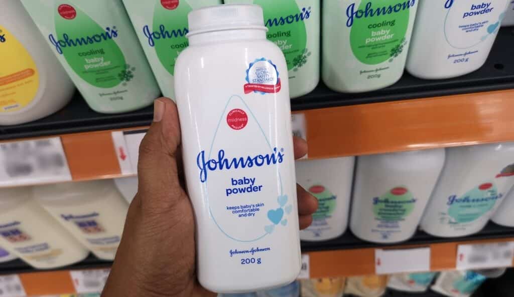 Close up view of Johnson's baby powder packages on the supermarket shelf.