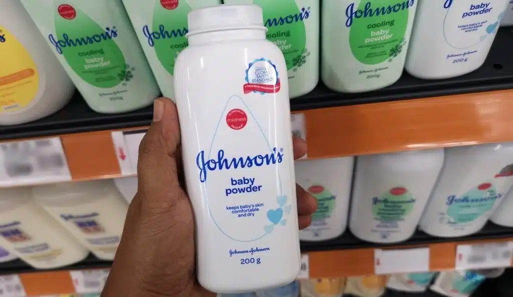 Close up view of Johnson's baby powder packages on the supermarket shelf.