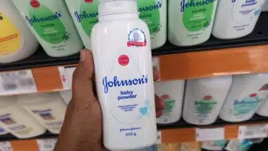 Close up view of Johnson's baby powder packages on the supermarket shelf.