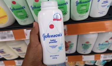 Close up view of Johnson's baby powder packages on the supermarket shelf.