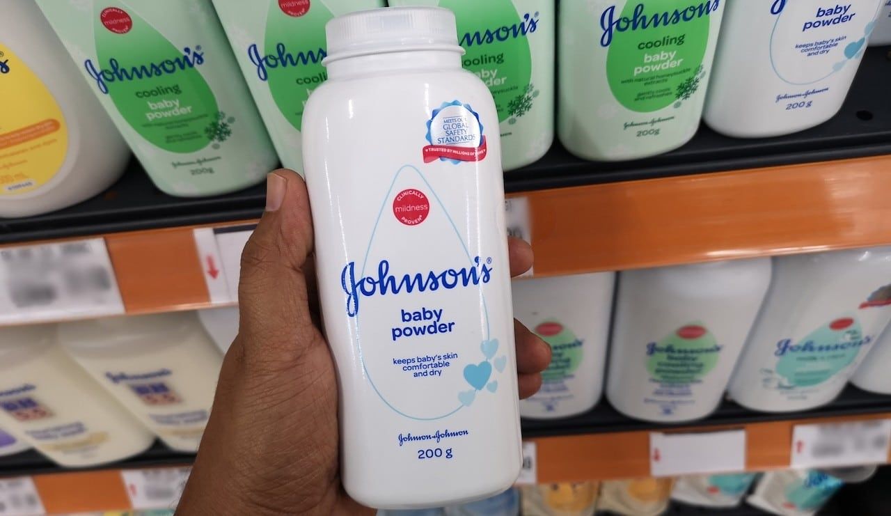 Close up view of Johnson's baby powder packages on the supermarket shelf.