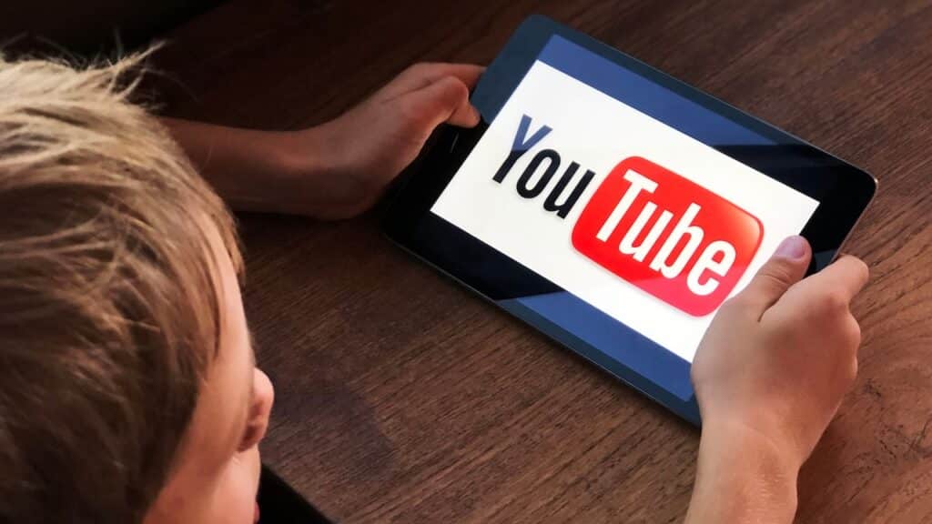 Boy watching Youtube kids on tablet