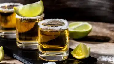 shots of gold Mexican tequila with lime and salt.