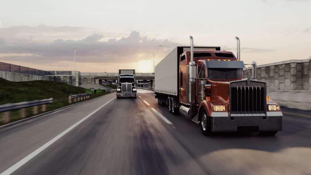 American style truck on freeway pulling load
