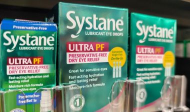 Display of Systane Lubricant Eye Drops on a Shelf in a Supermarket.