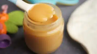 baby food in a container on table .