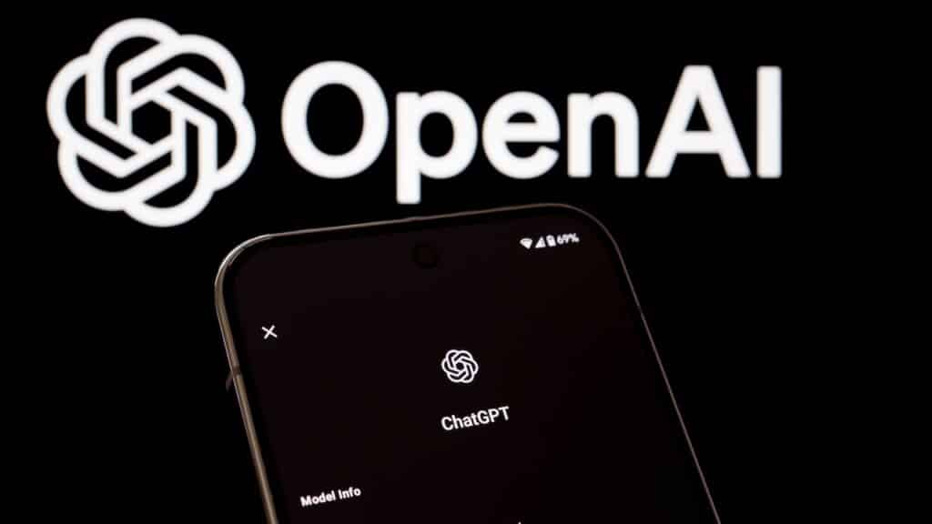 ChatGPT information displayed on smartphone in front of OpenAI logo.