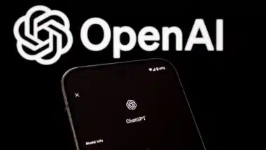 ChatGPT information displayed on smartphone in front of OpenAI logo.