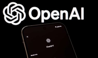 ChatGPT information displayed on smartphone in front of OpenAI logo.