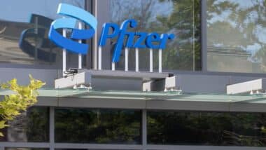 Pfizer sign is seen at an entrance to the company's office at Kendall Square in Cambridge, Massachusetts.