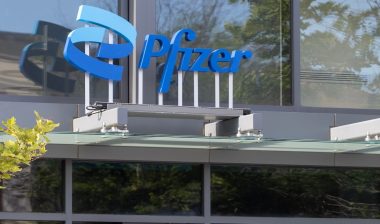 Pfizer sign is seen at an entrance to the company's office at Kendall Square in Cambridge, Massachusetts.