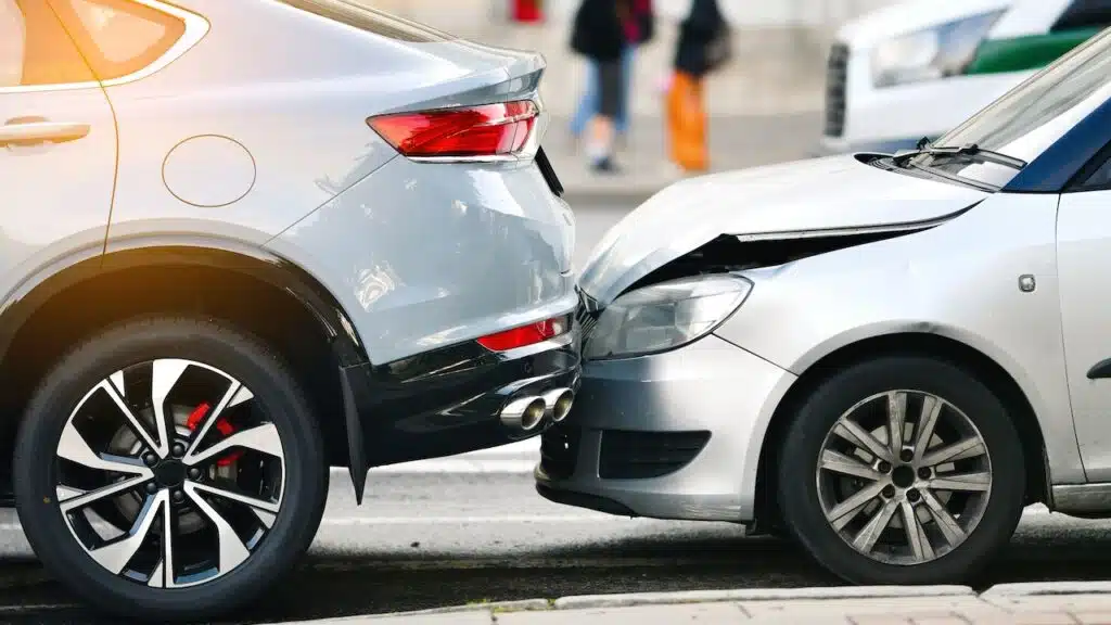 Rear end collision between two cars on urban street