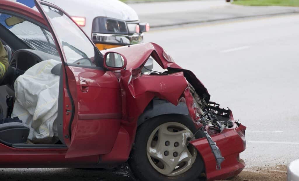 Rollover Vehicle Accident at Busy Intersection With Emergency Personnel to Assist