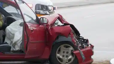 Rollover Vehicle Accident at Busy Intersection With Emergency Personnel to Assist