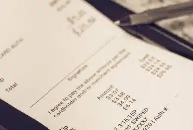 a receipt with hand written total amount and tipping
