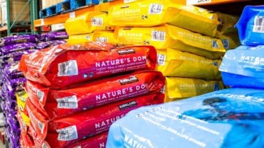 A view of several varieties of Kirkland Signature Nature's Domain dog food on display at a local Costco.