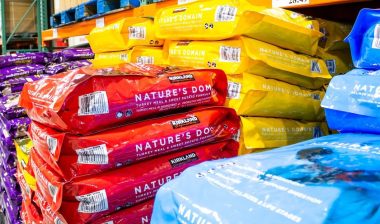 A view of several varieties of Kirkland Signature Nature's Domain dog food on display at a local Costco.
