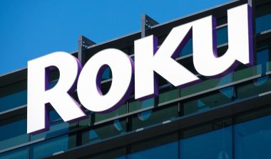 Roku sign and logo on facade of consumer electronics and broadcast media company headquarters in Silicon Valley