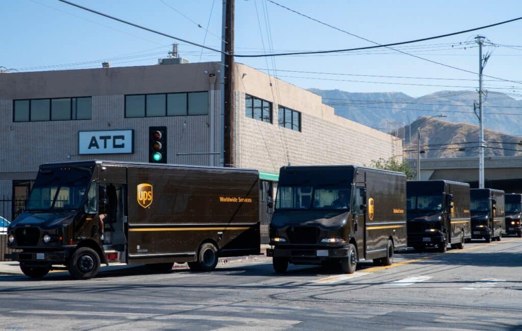 UPS (United Parcel Service) drivers and delivery trucks. Residential delivery service.