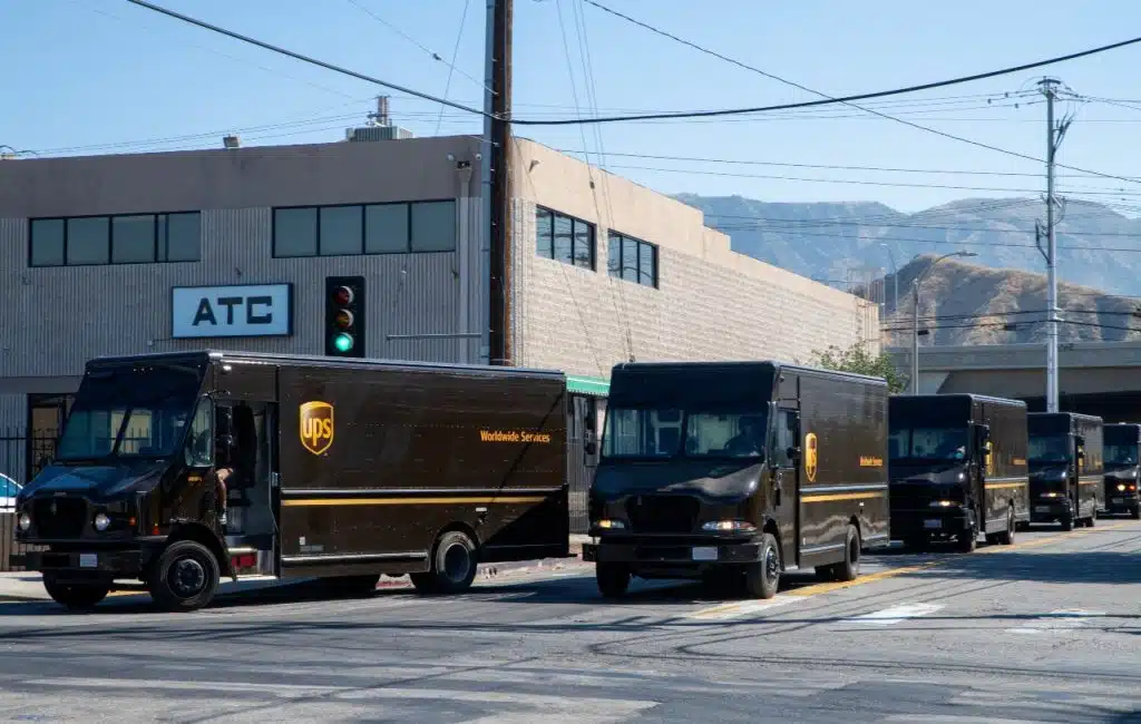 UPS (United Parcel Service) drivers and delivery trucks. Residential delivery service.